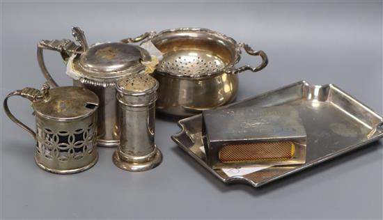 A heavy silver trinket dish, 13cm, two George V drum mustards, a tea strainer and stand, a matchbox holder